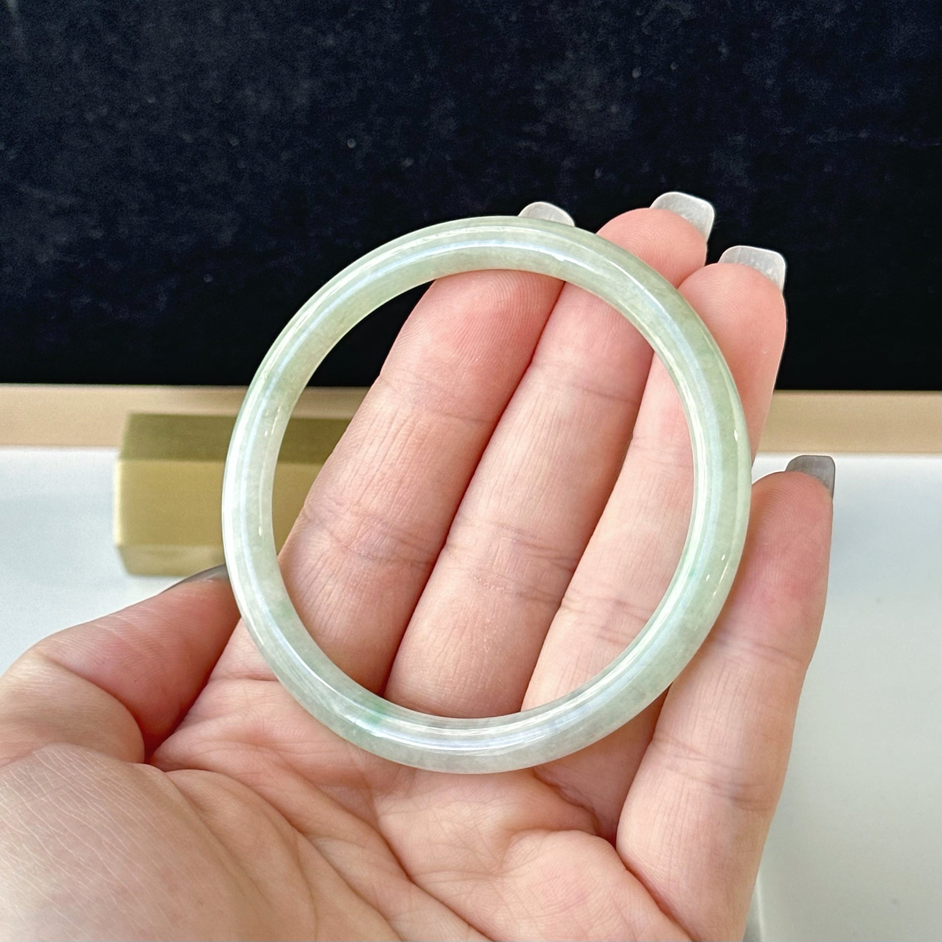 12857 57.0mm Translucent Green Slim Cut Rounded Jade Bangle