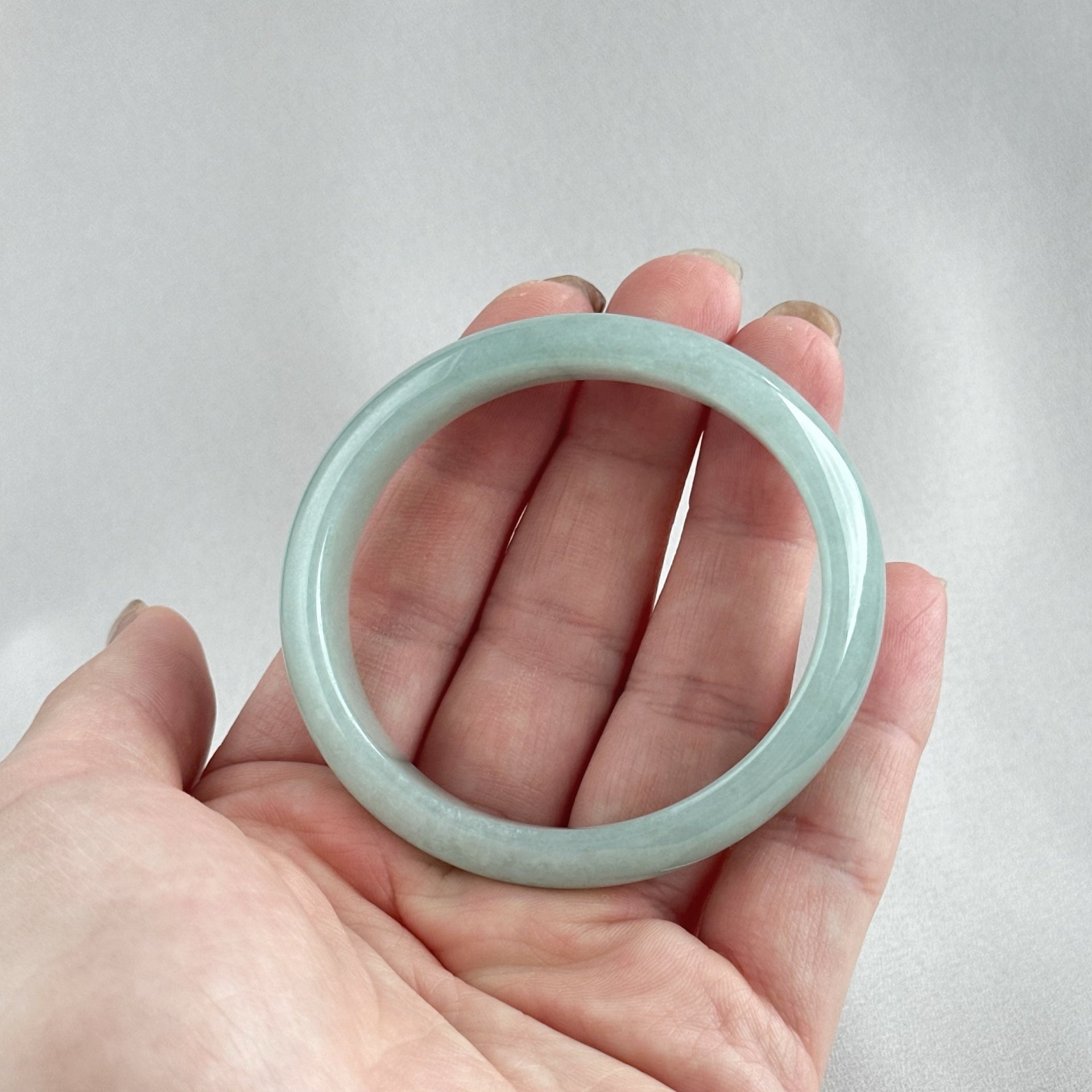 蓝静云光 Glacier Blue Oval Jadeite Bangle 55.0mm