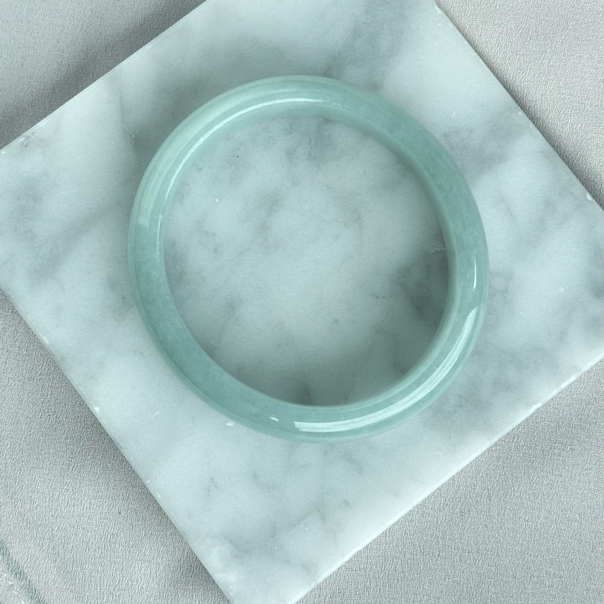 蓝静云光 Glacier Blue Oval Jadeite Bangle 55.0mm