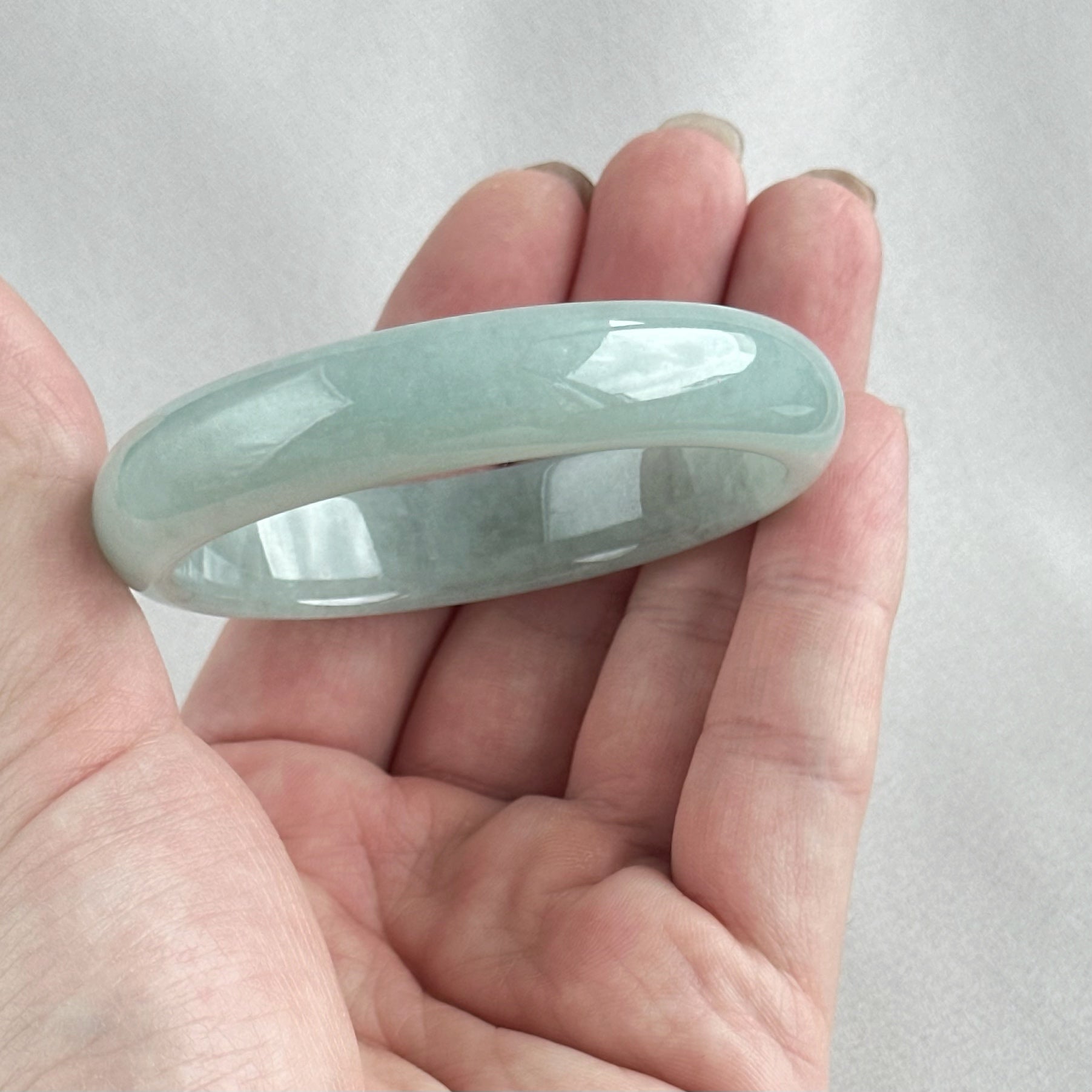 蓝静云光 Glacier Blue Oval Jadeite Bangle 55.0mm